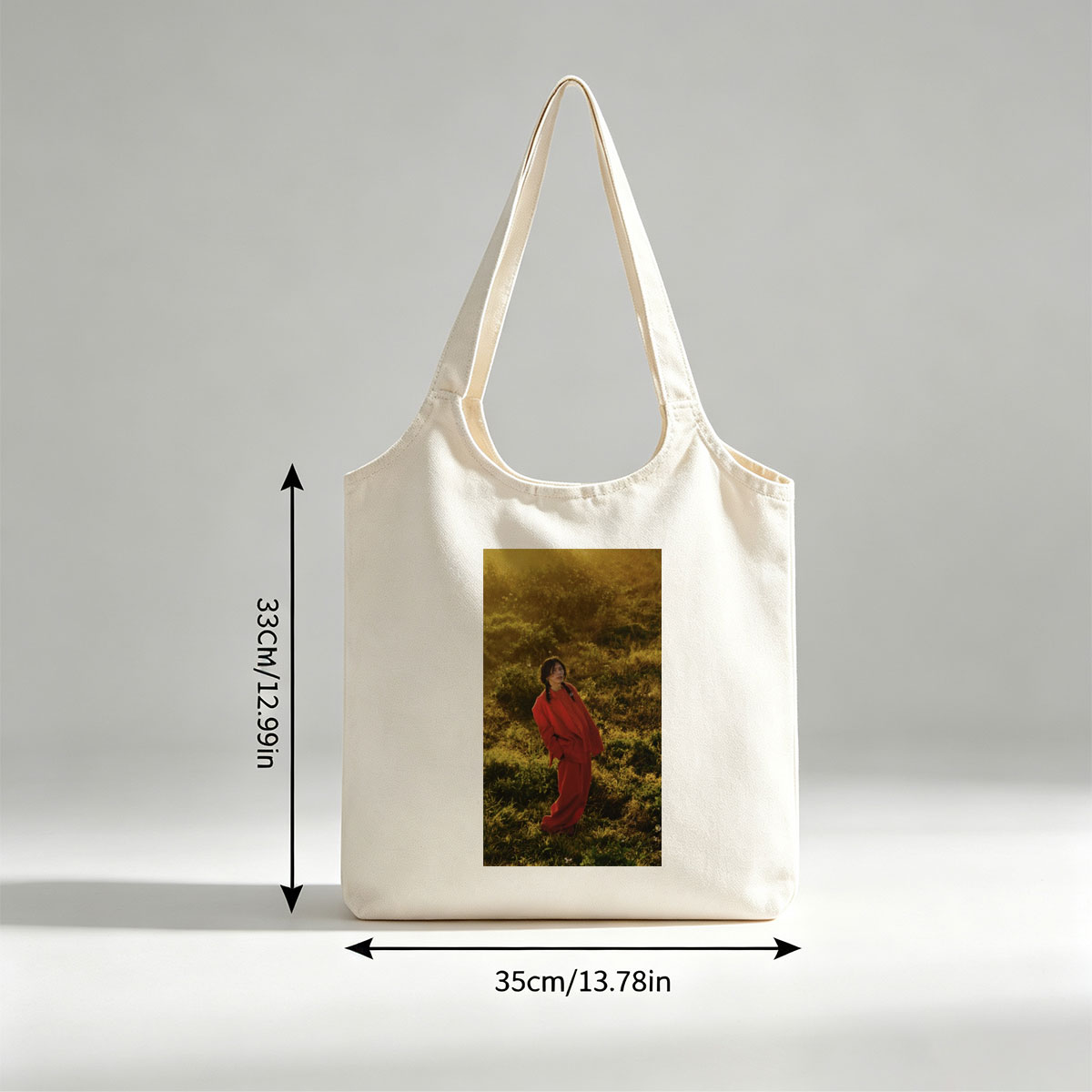 Billie Eilish in a Field Wearing a Red Outfit at Sunset - Canvas shoulder bags/