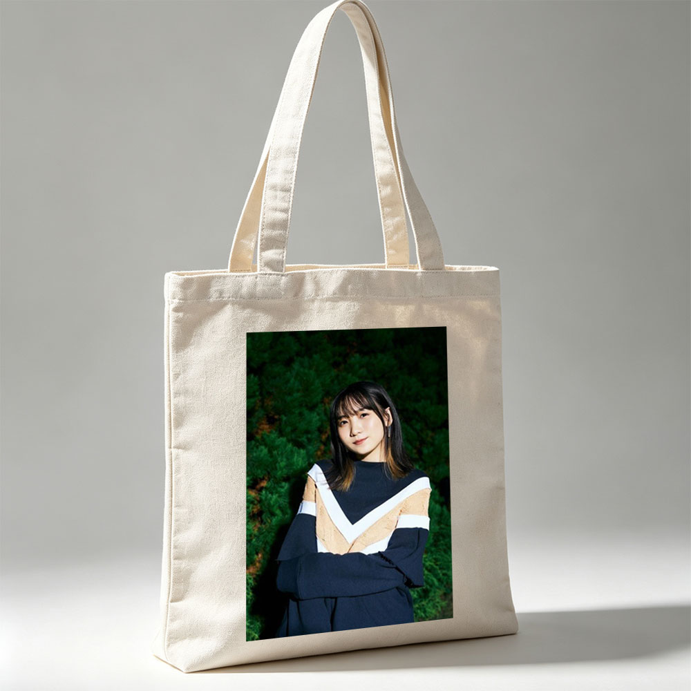 Yui Aragaki in a Stylish Outdoor Portrait with Arms Crossed Against Greenery Background - Canvas tote bags