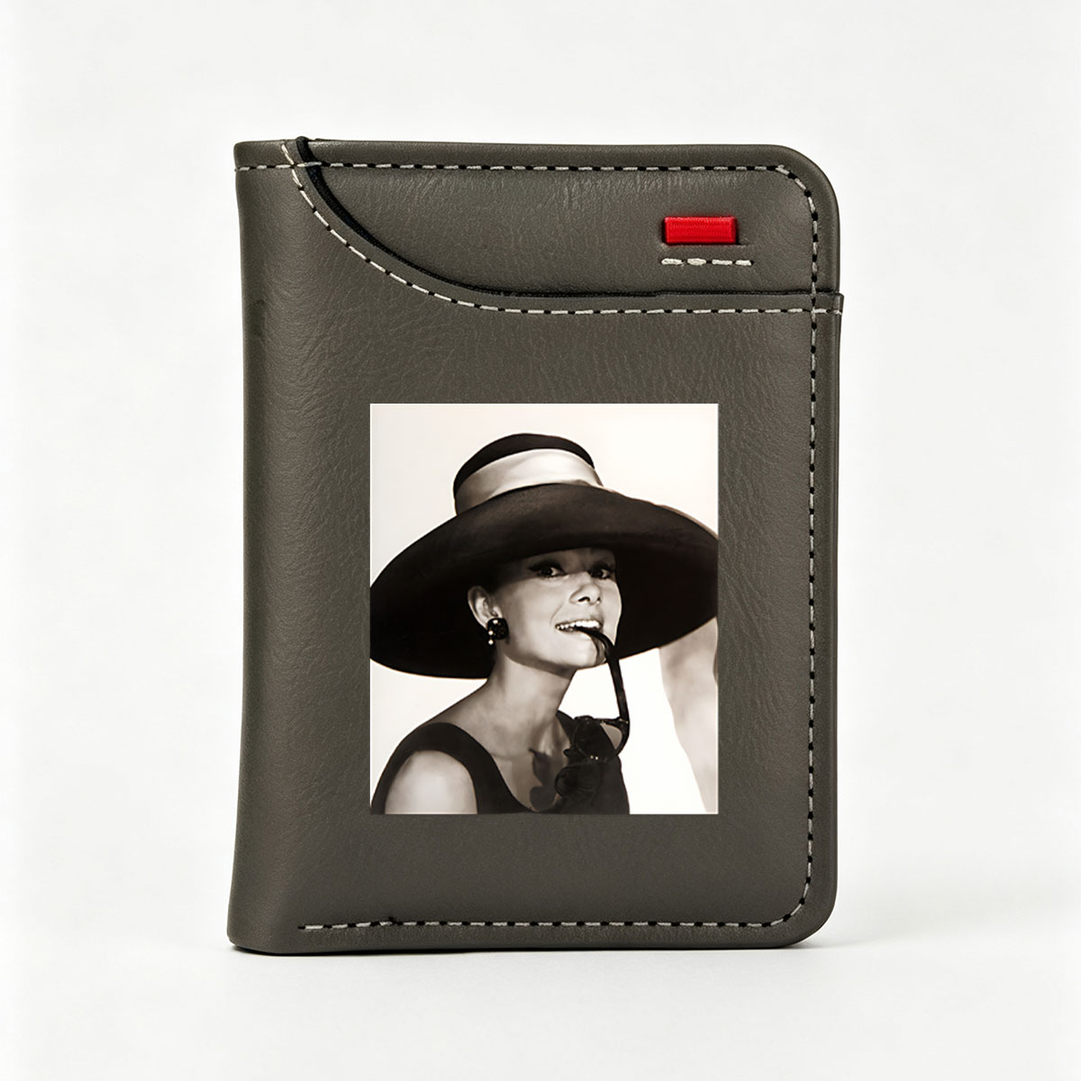 Audrey Hepburn in a wide-brimmed hat and sunglasses, exuding elegance and charm. - Vertical Style Wallet