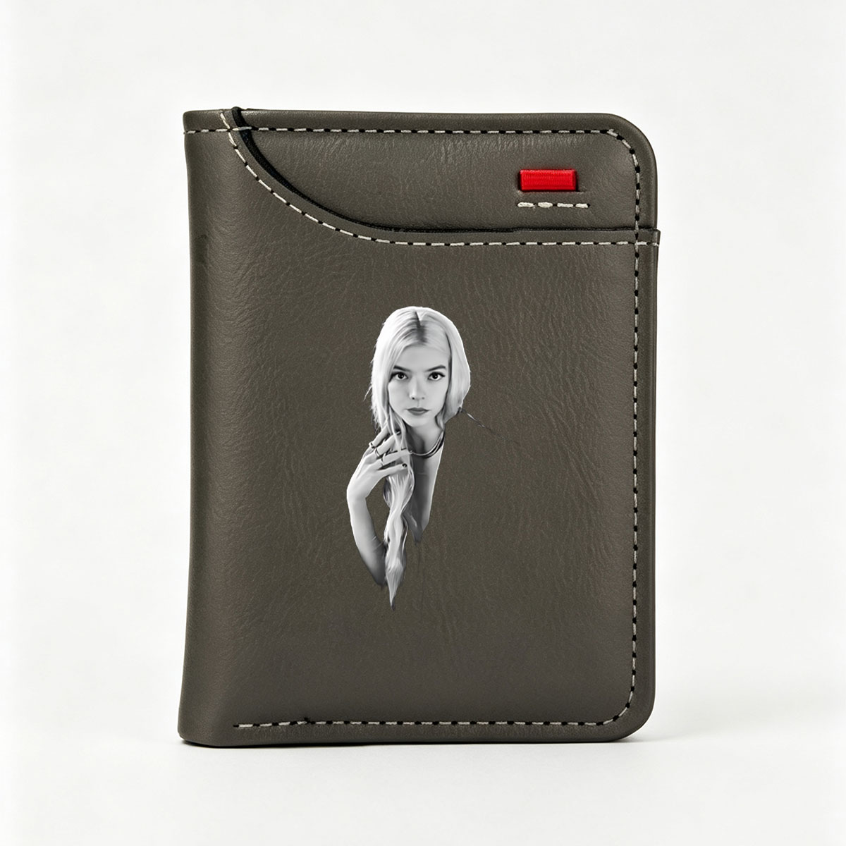 Anya Taylor-Joy in a striking black and white portrait, showcasing her elegant style and poised expression. - Vertical Style Wallet