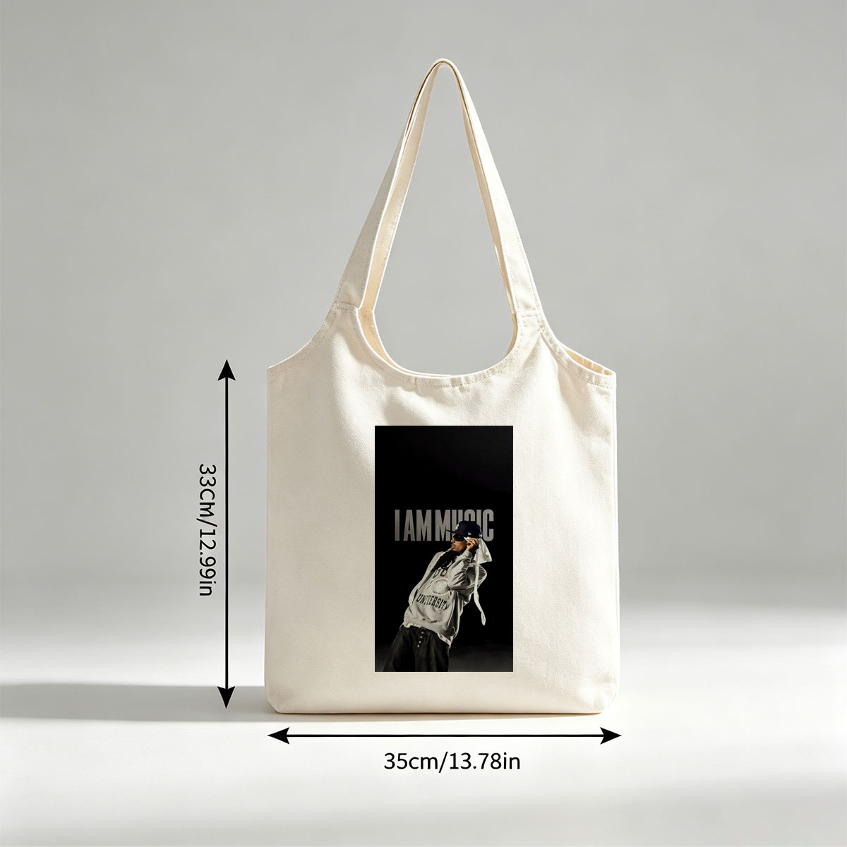 IamMusic Artist in Stylish Pose Wearing Hoodie and Cap Against Dark Background - Canvas shoulder bags/