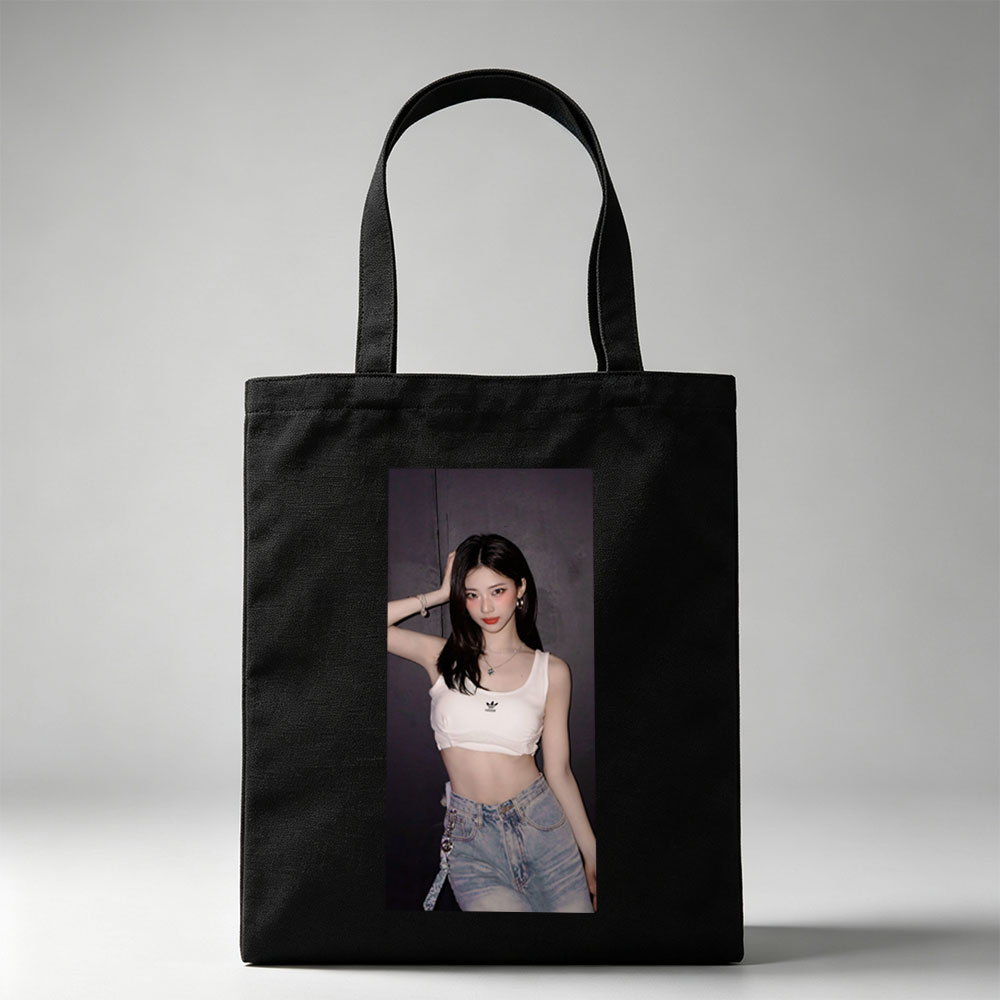 Korean Celebrity in Casual Outfit Wearing White Adidas Crop Top and High-Waisted Jeans Against Dark Background - Canvas tote bags