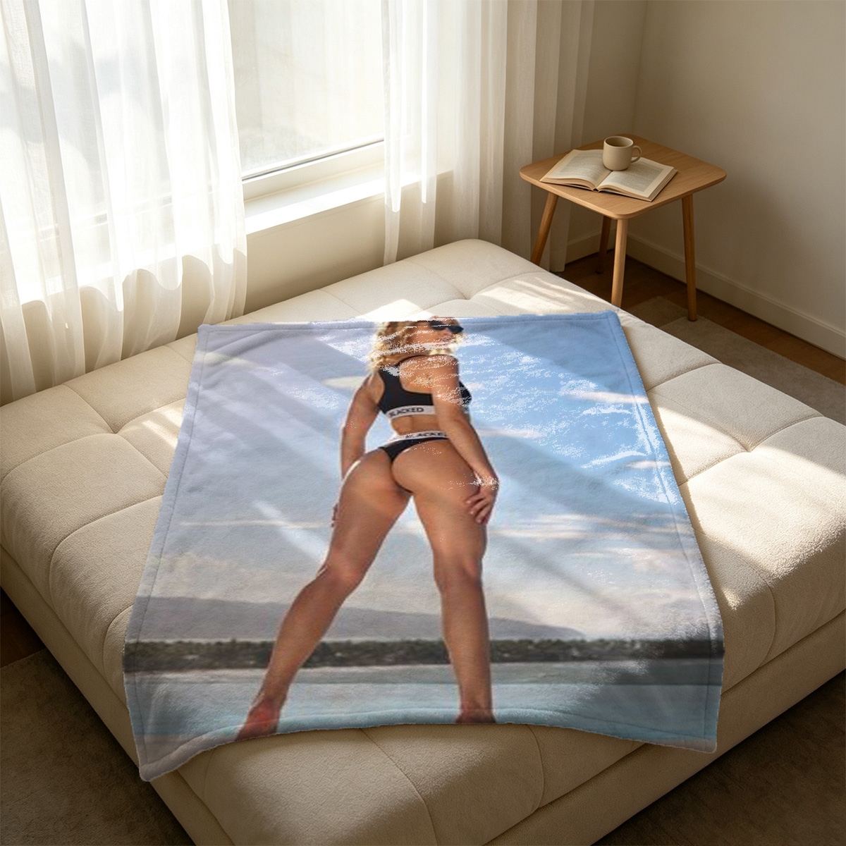 Nude barefoot woman lying on couch, blue eyes looking at viewer. - Blanket