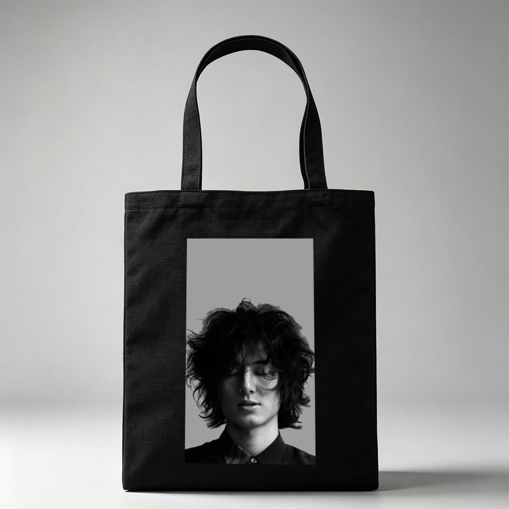Timothée Chalamet Close-Up Black and White Portrait with Messy Hair and Closed Eyes - Canvas tote bags
