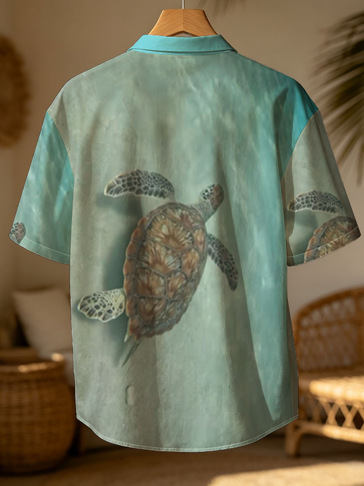 Sea turtle swimming gracefully over sandy ocean floor -  Shirt