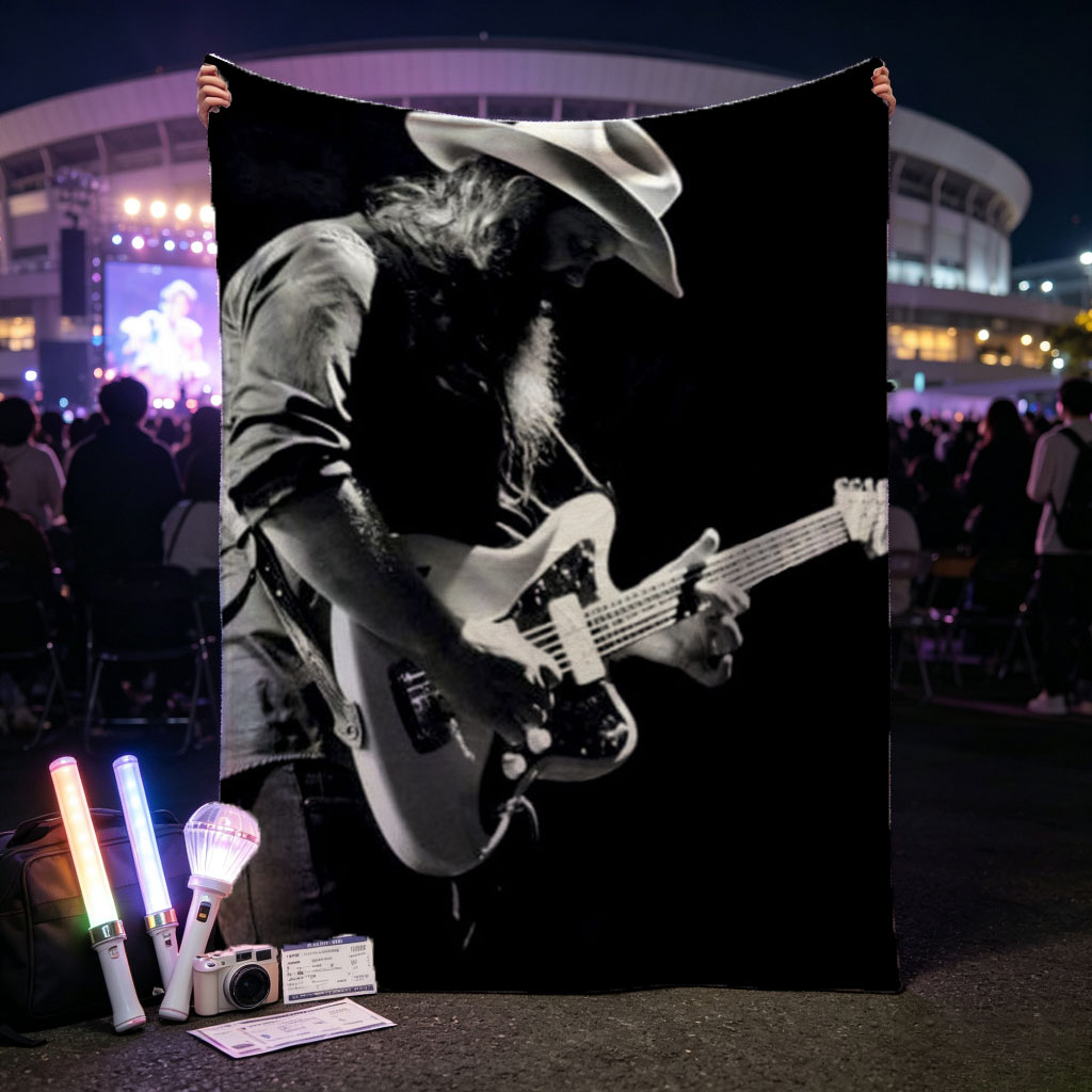 Stevie Ray Vaughan Playing Guitar on Stage in Black and White Photo - Blankets