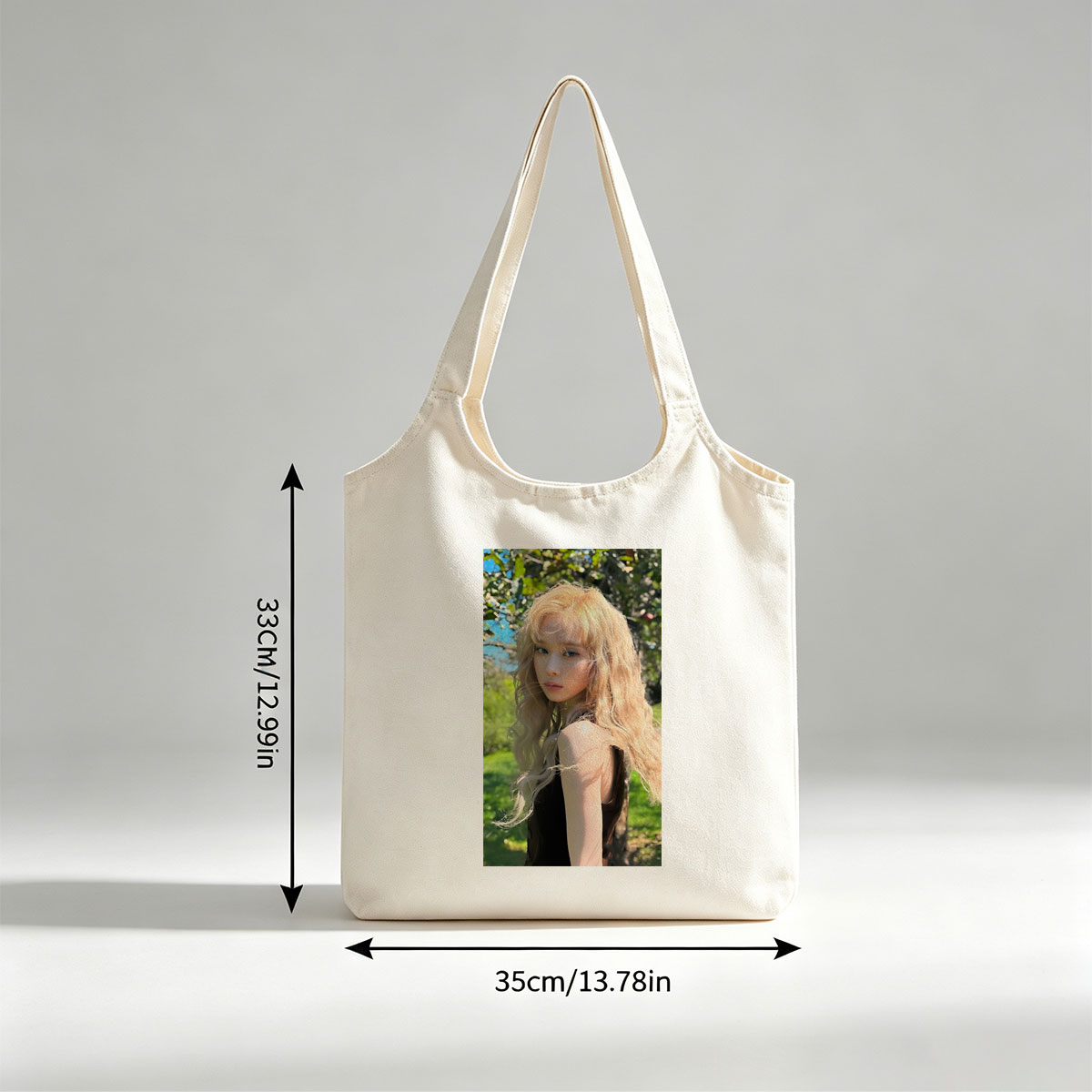 Kim Yoo Jung in a Sunlit Garden with Flowing Blonde Hair and Elegant Black Dress - Canvas shoulder bags/