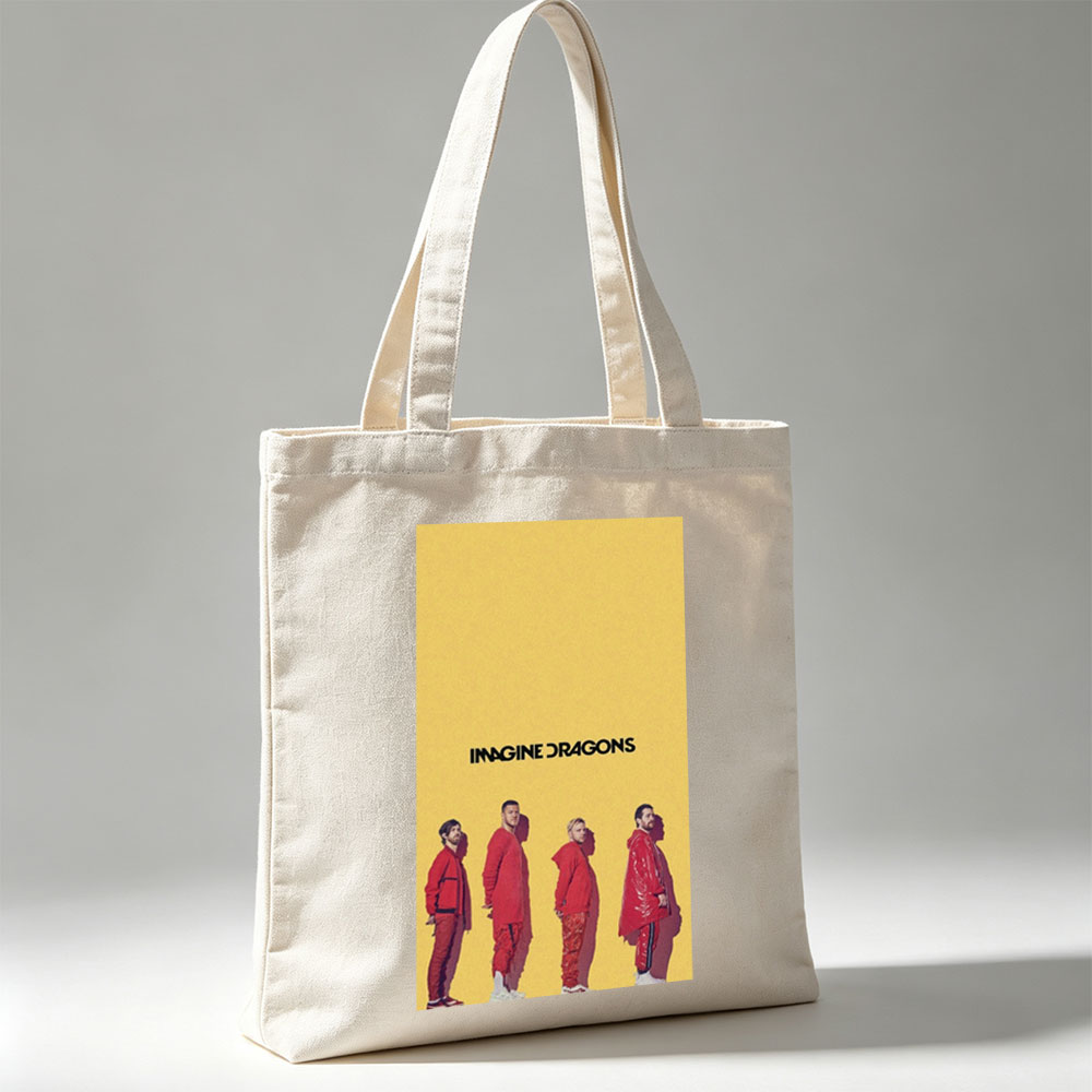 Imagine Dragons Standing in Red Outfits Against a Yellow Background - Canvas tote bags