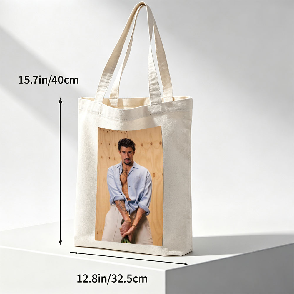 Bad Bunny in a Casual Pose Wearing an Open Light Blue Shirt and Beige Pants Against a Wooden Background - Canvas tote bags