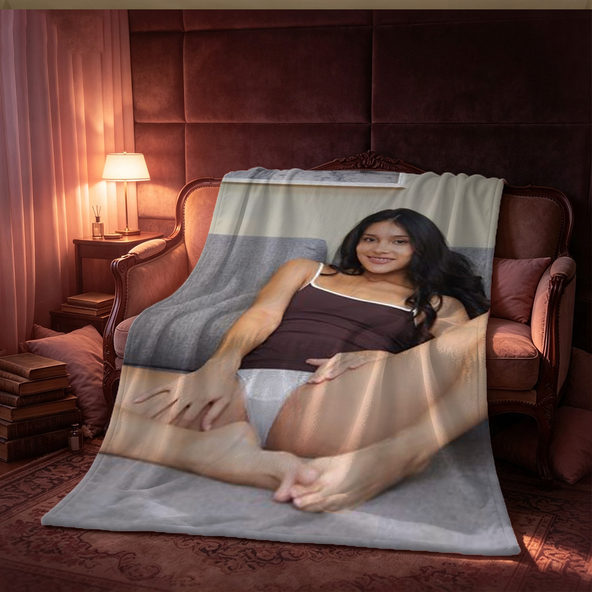 A woman in an unbuttoned white shirt posing on a bed. - Blanket