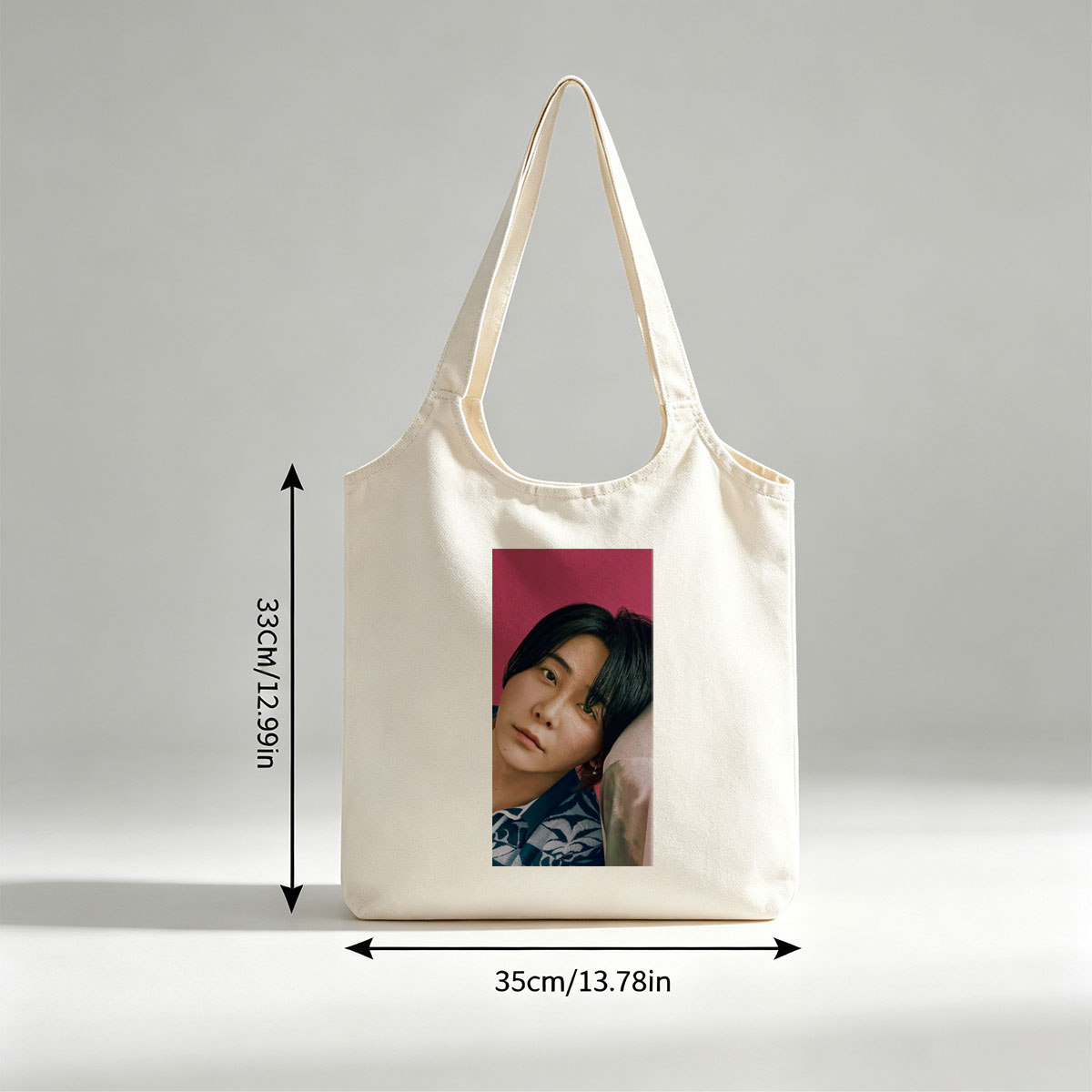 Yoshiki Hayashi in a Serene Pose Against a Vibrant Pink Background Wearing a Traditional Patterned Outfit - Canvas shoulder bags/