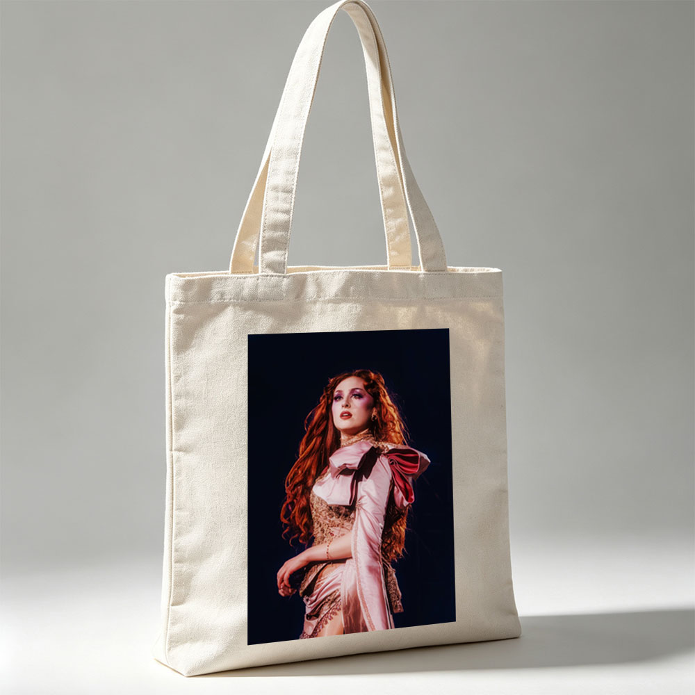Katy Perry in a Dramatic Performance Scene Wearing a Pink Satin Outfit with Elegant Makeup and Long Red Hair - Canvas tote bags