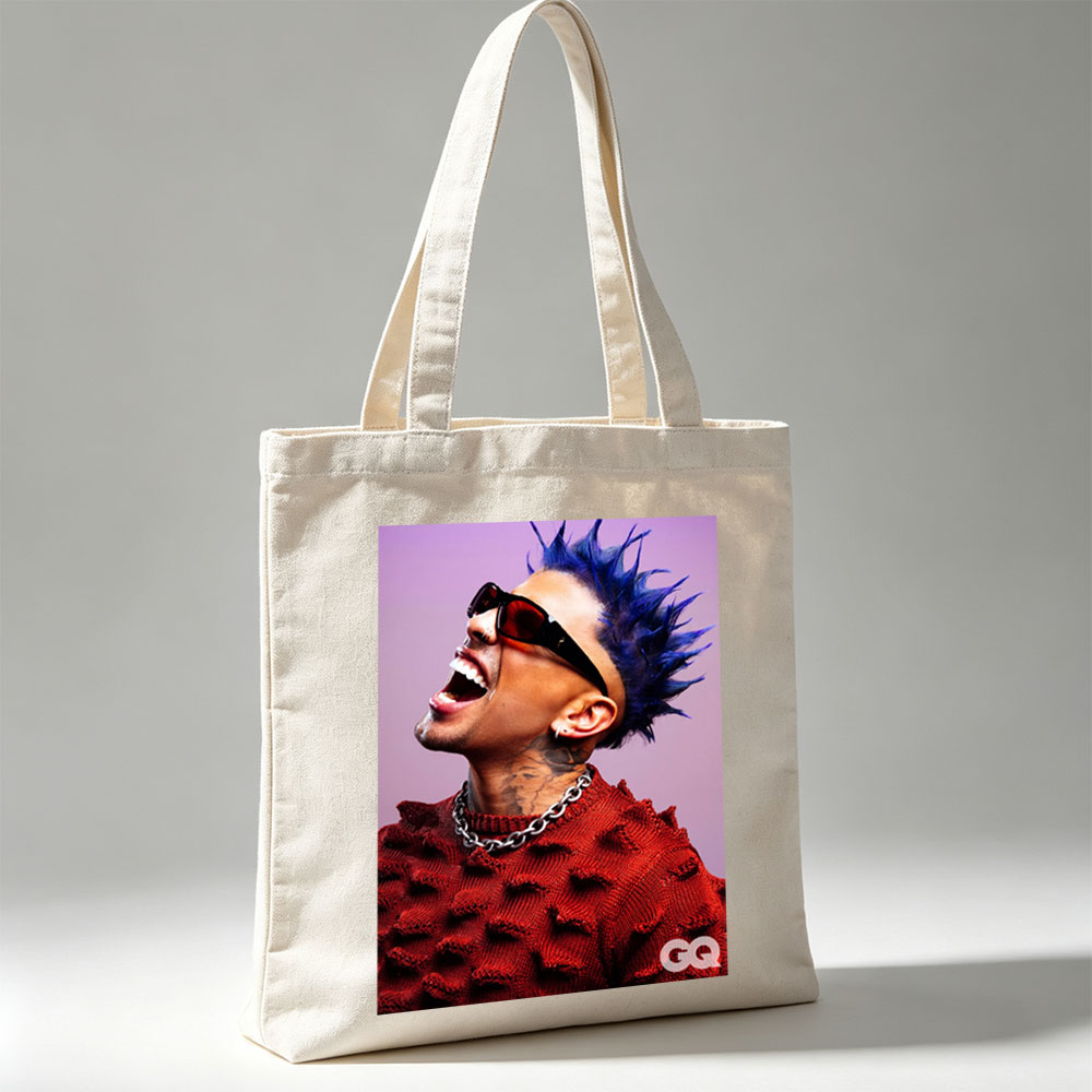 Daddy Yankee in a Bold Red Sweater with Spiky Blue Hair and Sunglasses, Laughing Loudly Against a Purple Background - Canvas tote bags