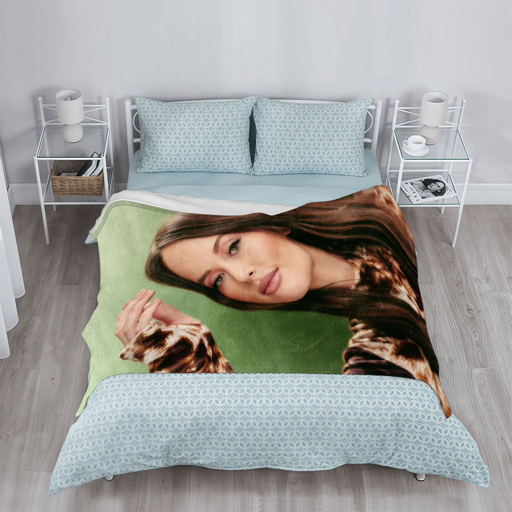 Olivia Rodrigo in a Fashion Portrait Wearing a Leopard Print Top Against a Green Background - Blankets