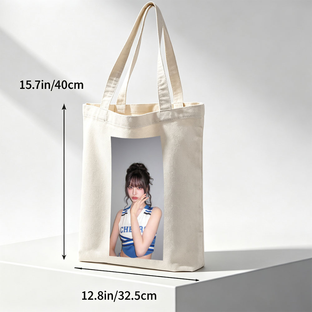 K-pop Idol in Cheerleader Outfit Poses with Hand on Face Against Gray Background - Canvas tote bags
