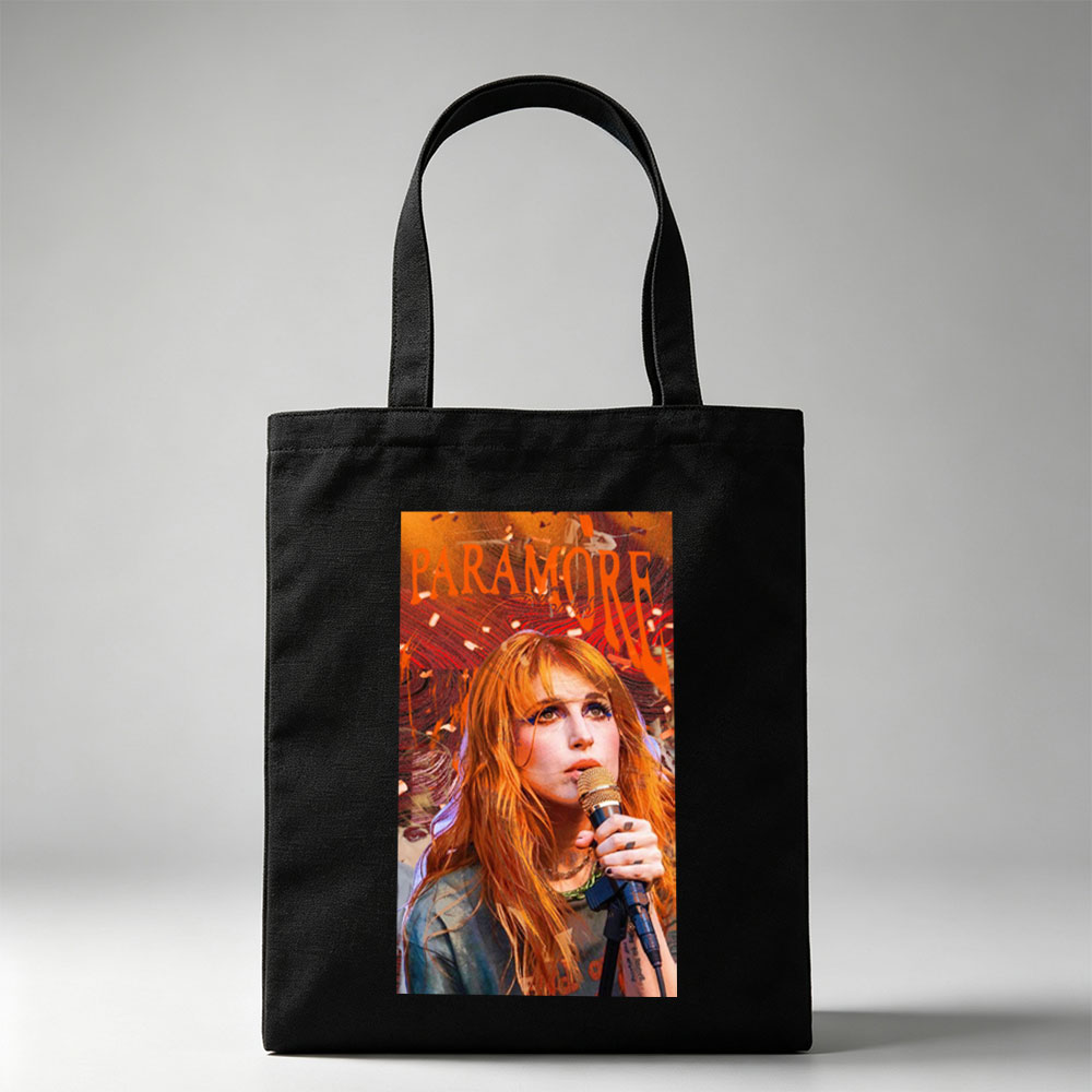 Paramore Live Performance - Hayley Williams Singing into Microphone with Vibrant Stage Background - Canvas tote bags