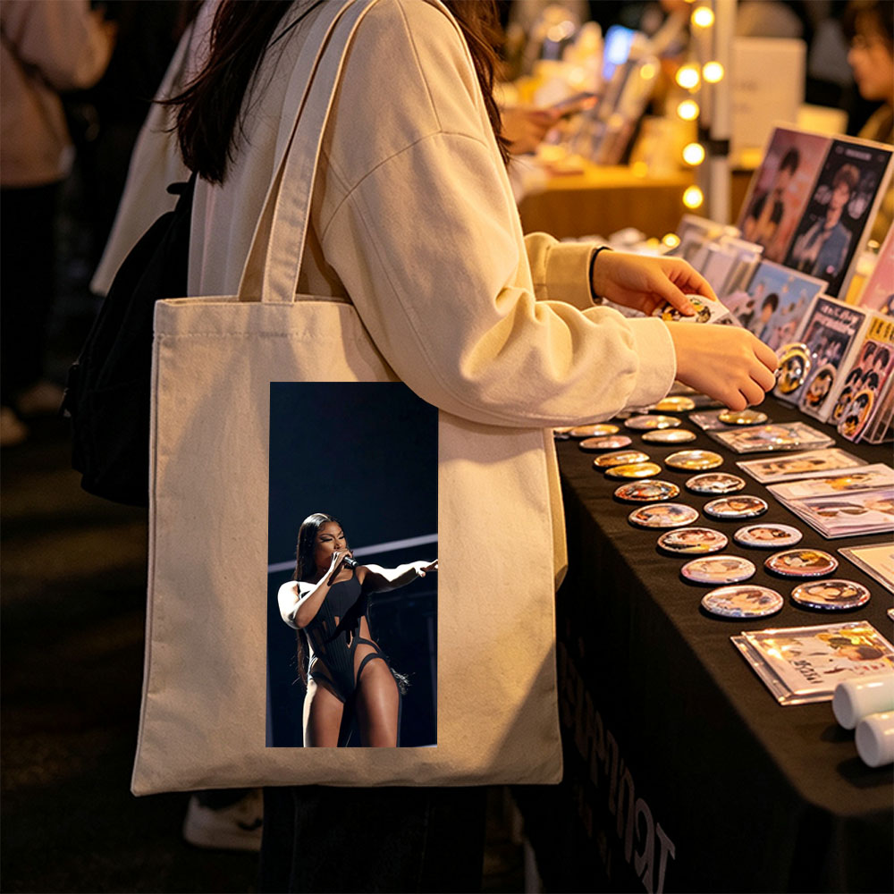 Cardi B Performing on Stage in a Black Bodysuit Holding a Microphone - Canvas tote bags