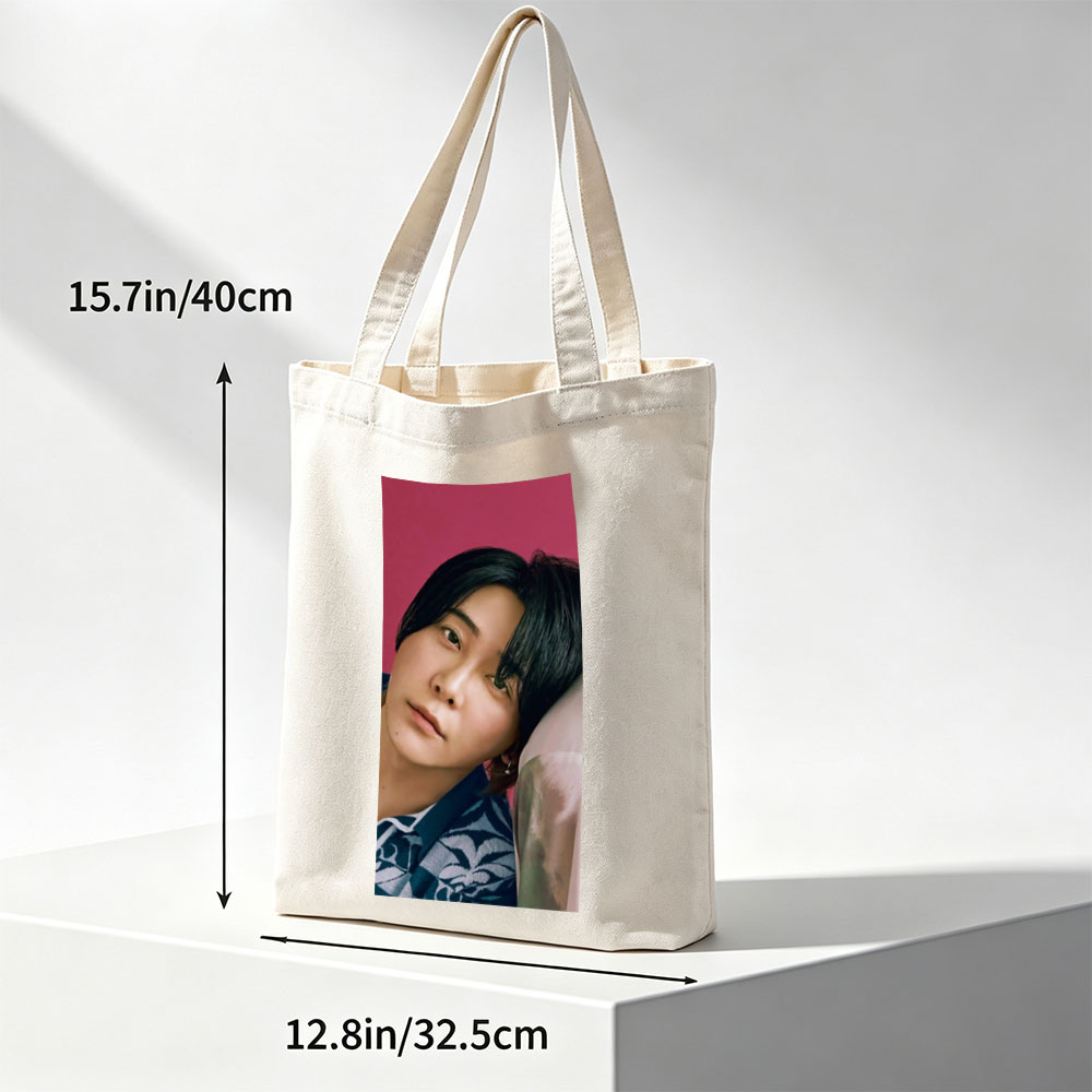Yoshiki Hayashi in a Serene Pose Against a Vibrant Pink Background Wearing a Traditional Patterned Outfit - Canvas tote bags