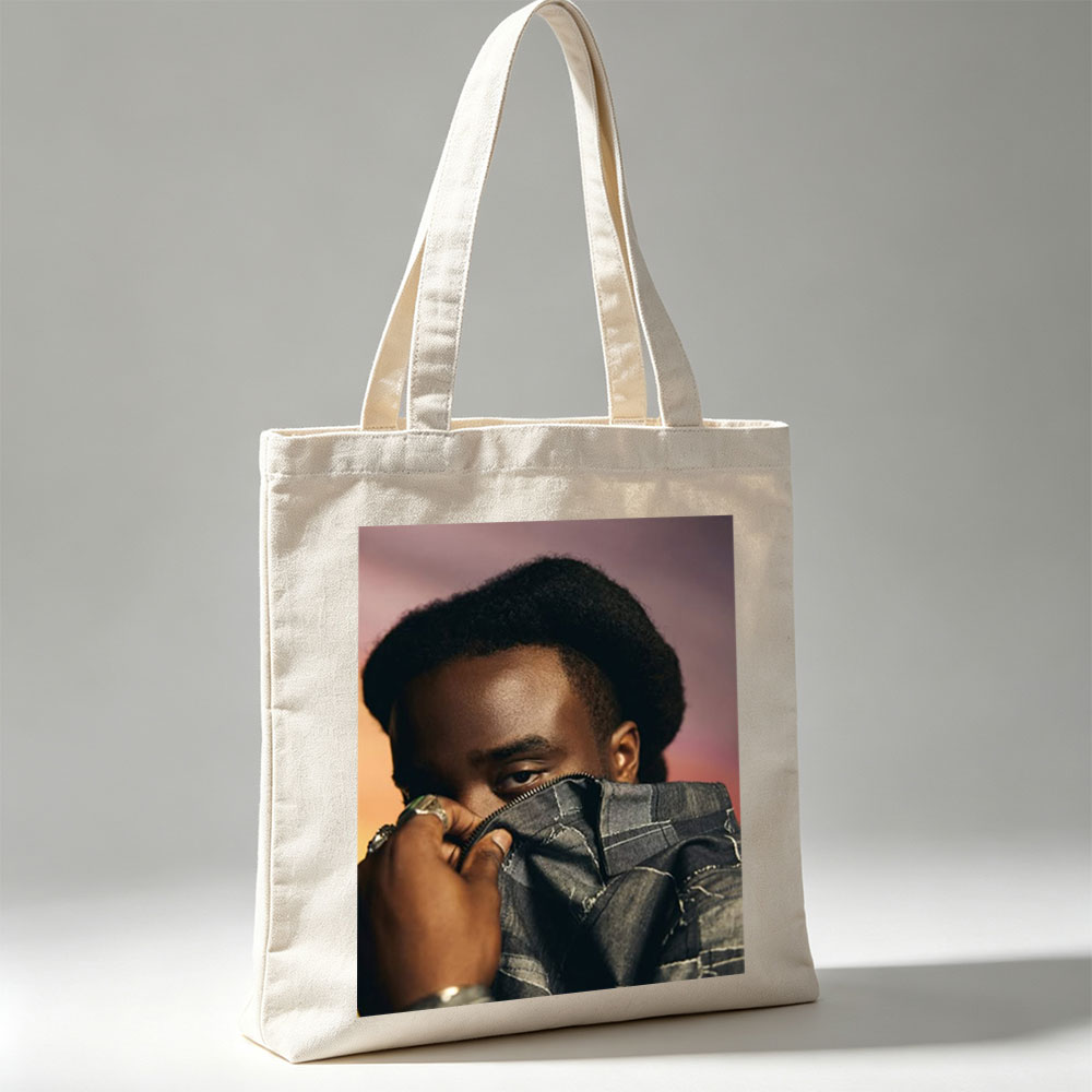Kendrick Lamar in a Bold Pose Holding Denim Jacket to Face - Canvas tote bags