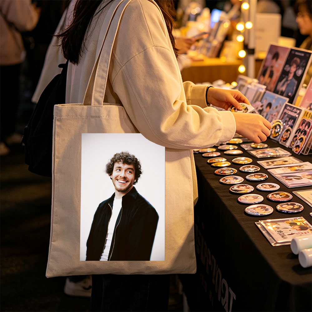 Matt Healy of The 1975 in a Candid Moment Wearing a Black Jacket and White Shirt Against a Plain Background - Canvas tote bags