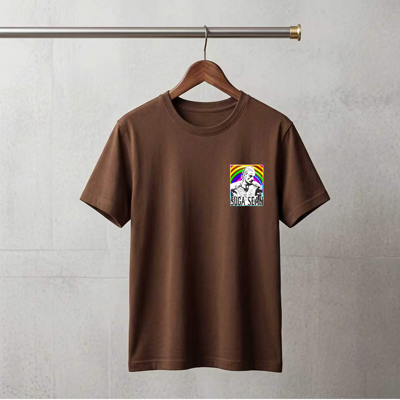 Suga Sean: Tattooed Man with Wings Against Rainbow Background - Tee
