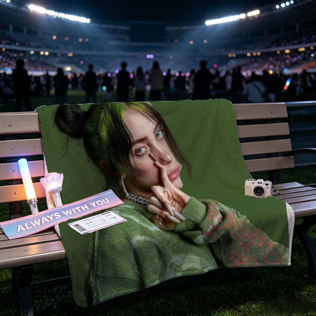 Billie Eilish in Studio Portrait Wearing Green Knit Sweater with Hair in Buns and Fingers on Face - Blankets