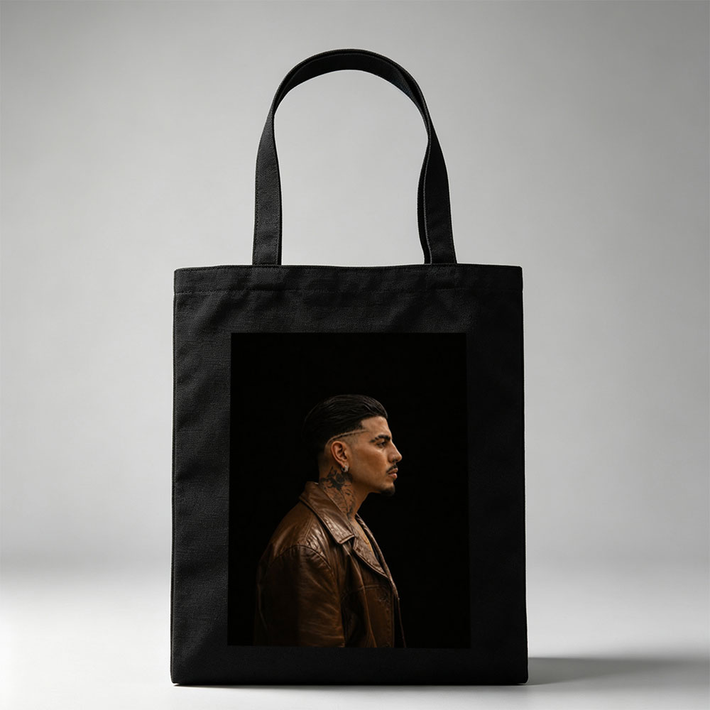 Bad Bunny in Profile Portrait Wearing Brown Leather Jacket Against Black Background - Canvas tote bags