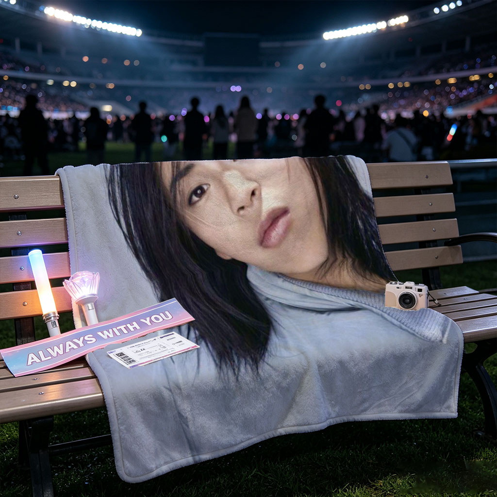 Yuki Kajiura in a Serene Portrait Wearing a Light Blue Collared Shirt Against a Soft Gray Background - Blankets