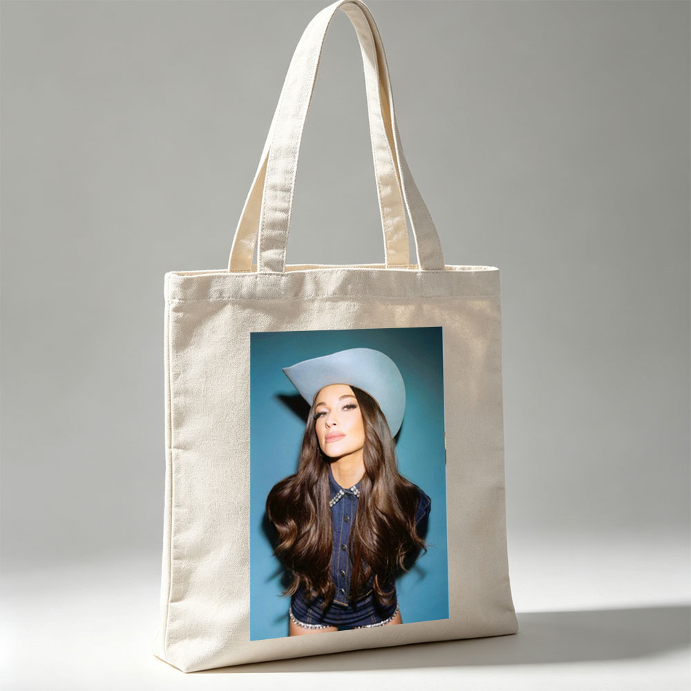 Kacey Musgraves in a Cowboy Hat and Denim Outfit Against a Blue Background - Canvas tote bags