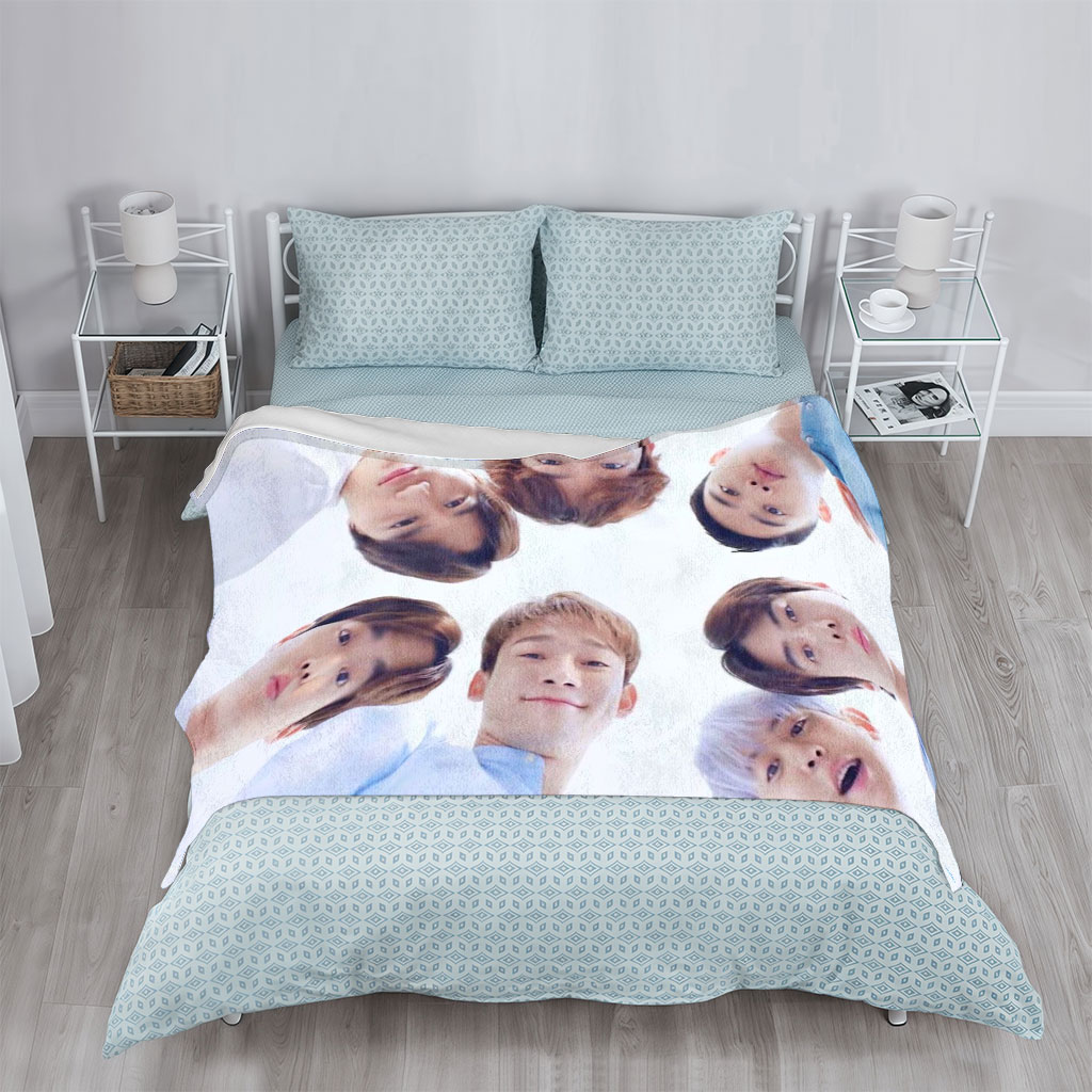 NCT Dream Members in a Circular Formation Wearing Light Blue Outfits Against a Bright Sky Background - Blankets