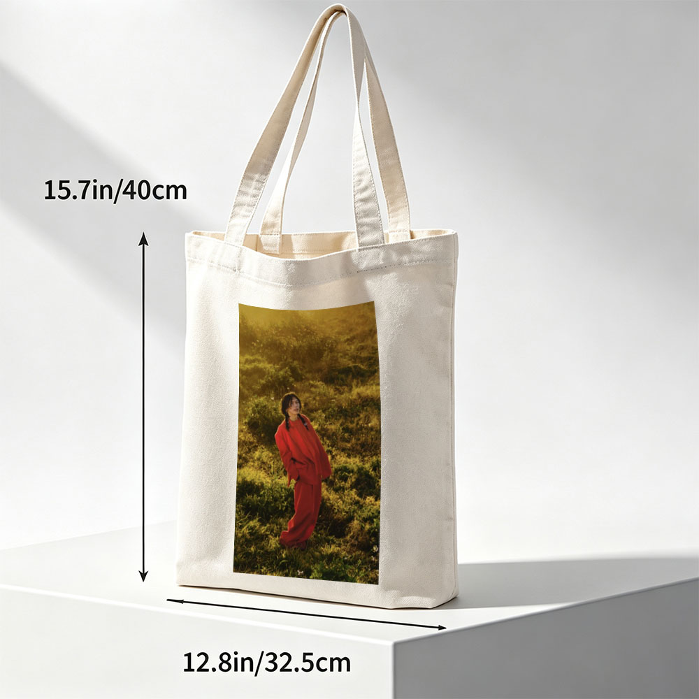 Billie Eilish in a Field Wearing a Red Outfit at Sunset - Canvas tote bags