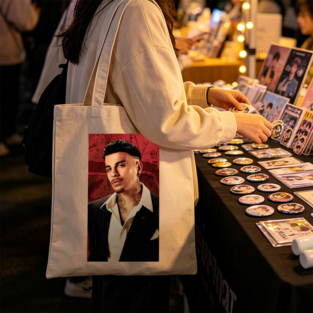 Bad Bunny in a Sharp Suit with Visible Neck Tattoos Against a Red Grunge Background - Canvas tote bags