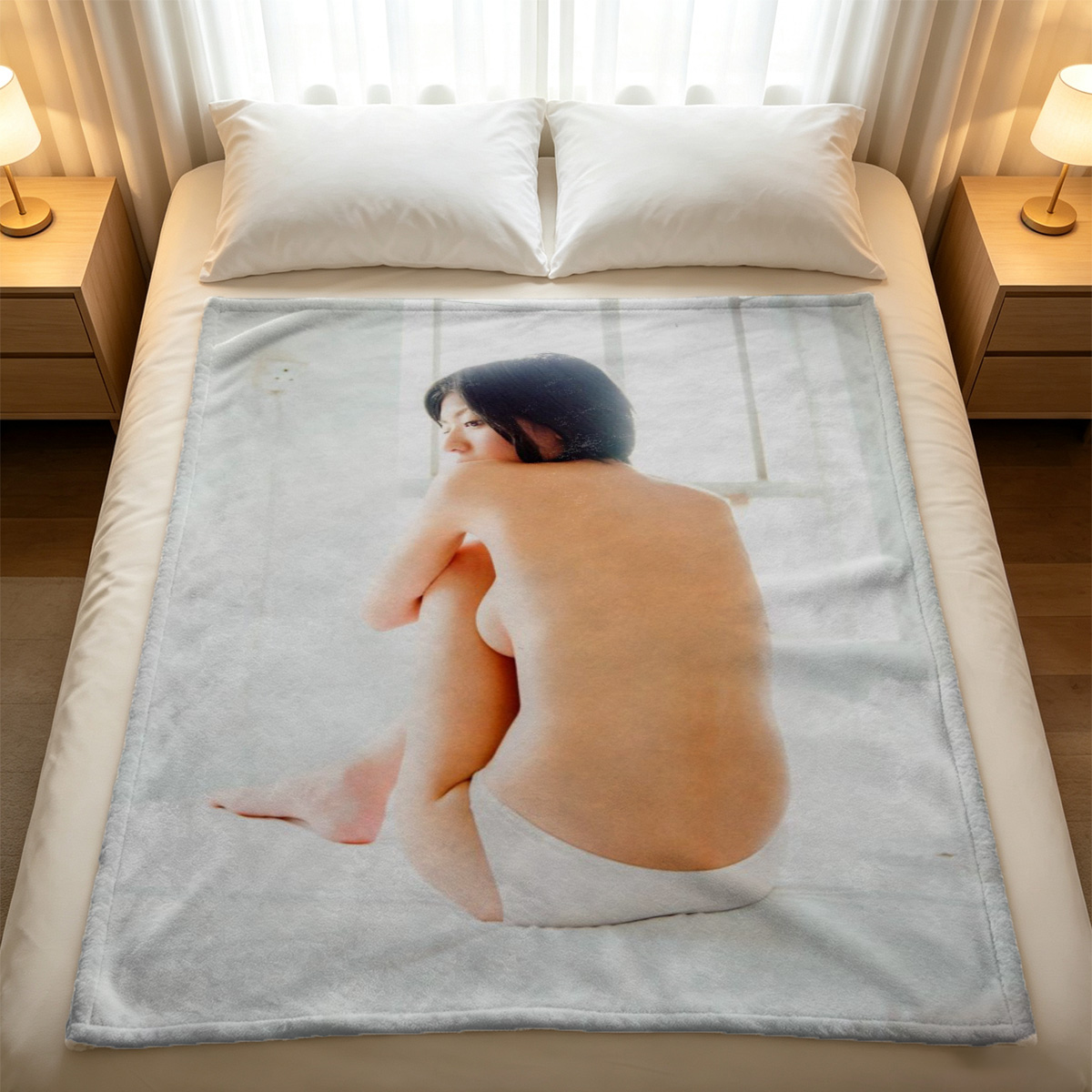 Blonde woman in striped bodysuit posing on wooden table. - Blanket