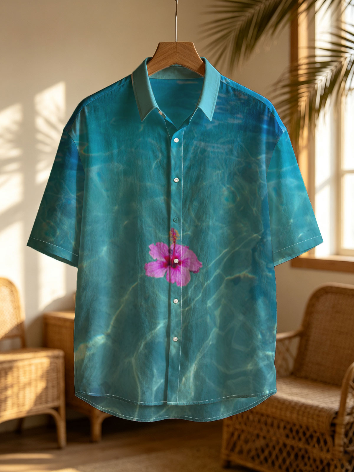 Pink hibiscus floating on crystal clear turquoise water -  Shirt