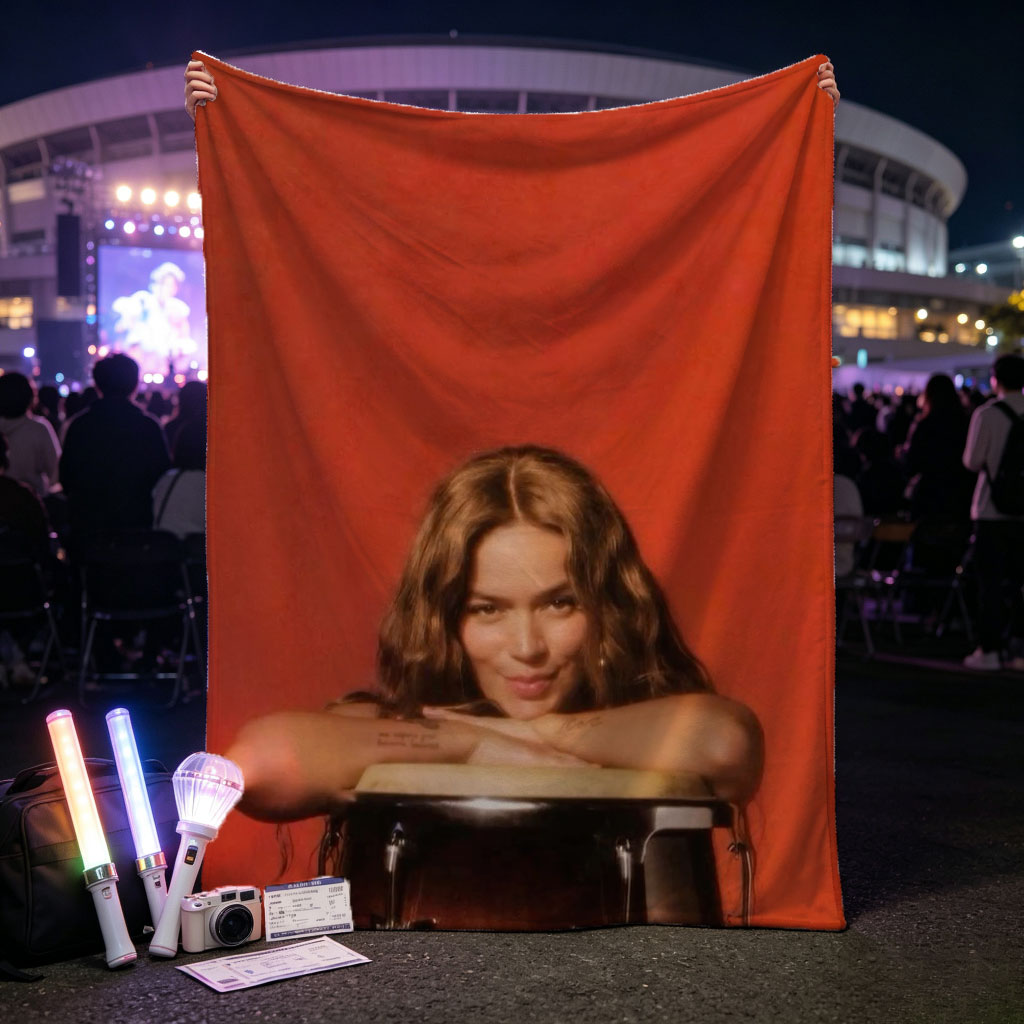 Rita Ora Leaning on a Drum Against a Red Background - Blankets