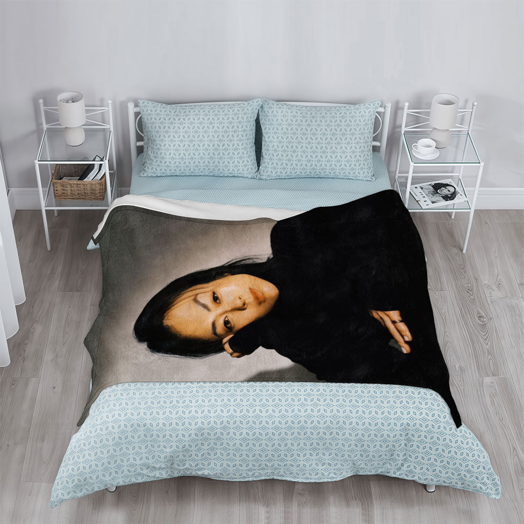 Yoko Kanno in a Moody Portrait Wearing Black Turtleneck with Dramatic Lighting - Blankets