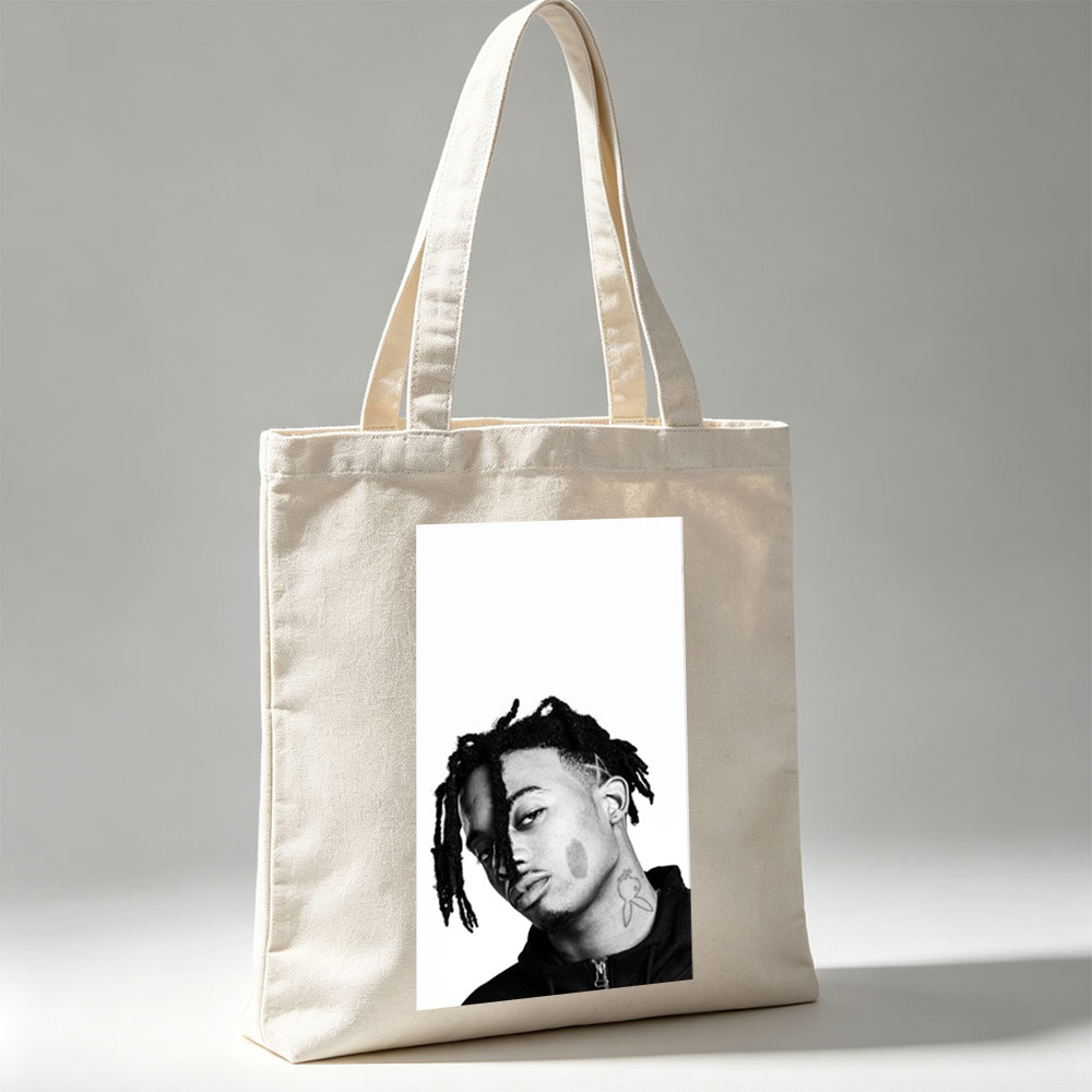 XXXTentacion in a striking black and white portrait with dreadlocks and neck tattoo, captured in a contemplative side profile. - Canvas tote bags