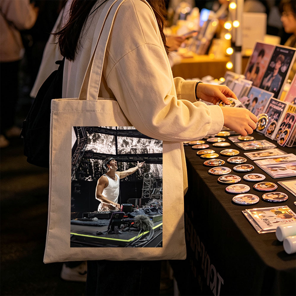 Martin Garrix Live Performance on Stage with DJ Equipment and Energetic Gesture - Canvas tote bags