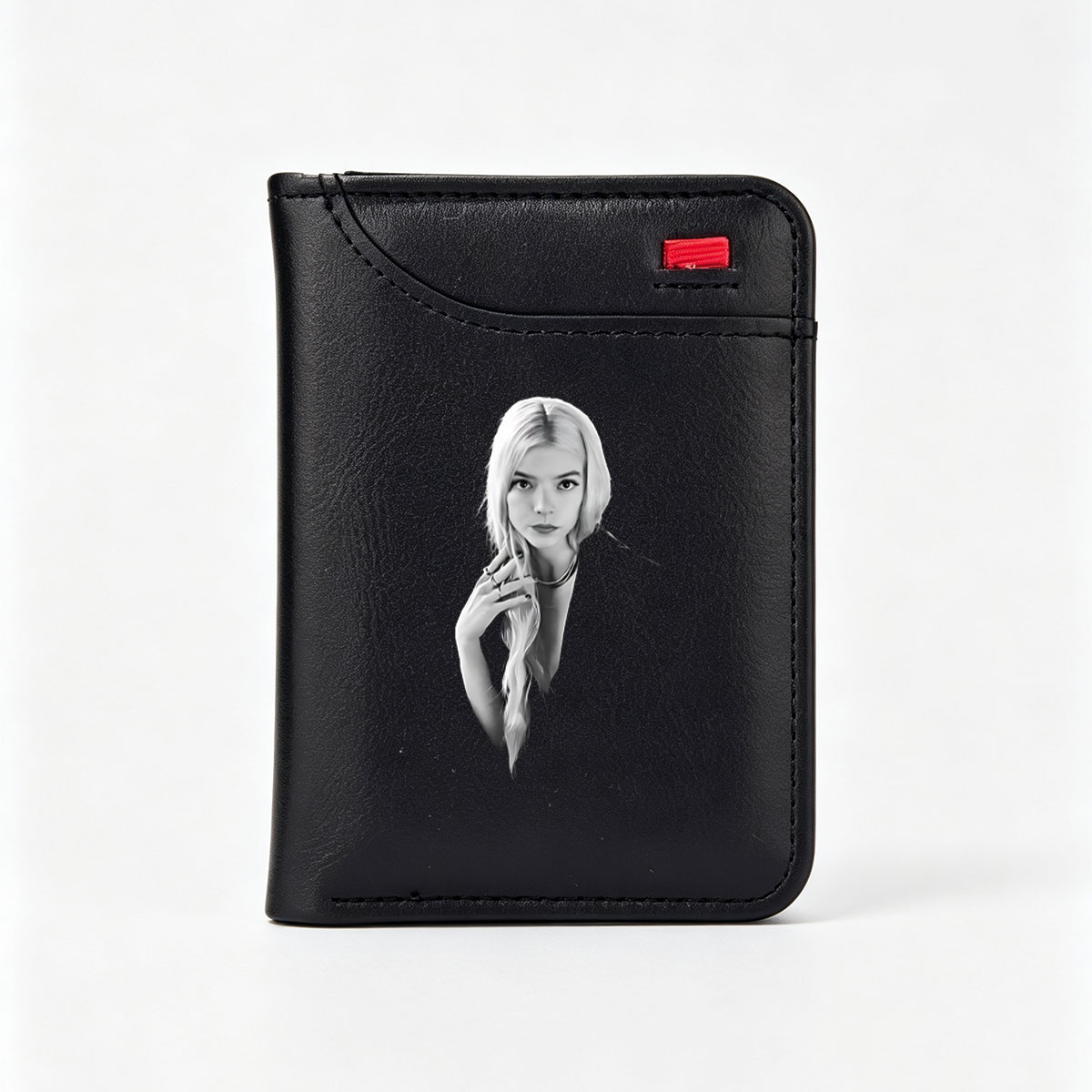 Anya Taylor-Joy in a striking black and white portrait, showcasing her elegant style and poised expression. - Vertical Style Wallet