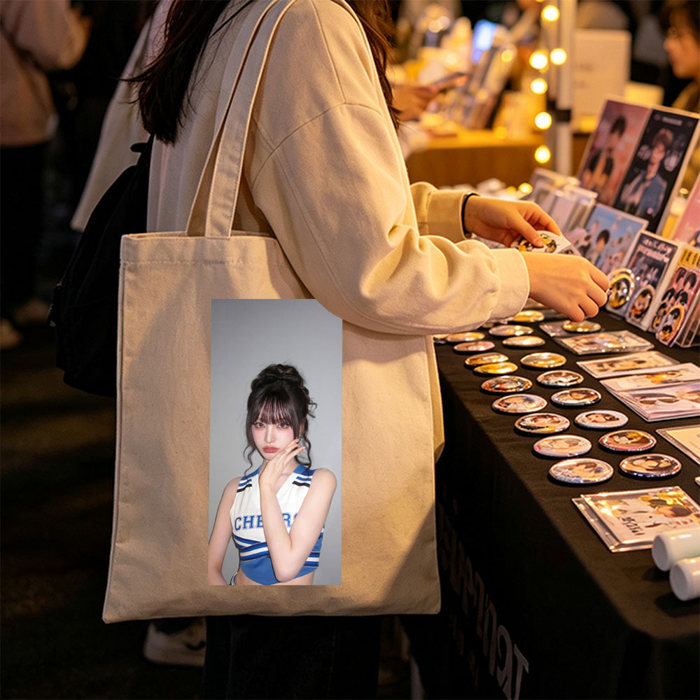 K-pop Idol in Cheerleader Outfit Poses with Hand on Face Against Gray Background - Canvas tote bags