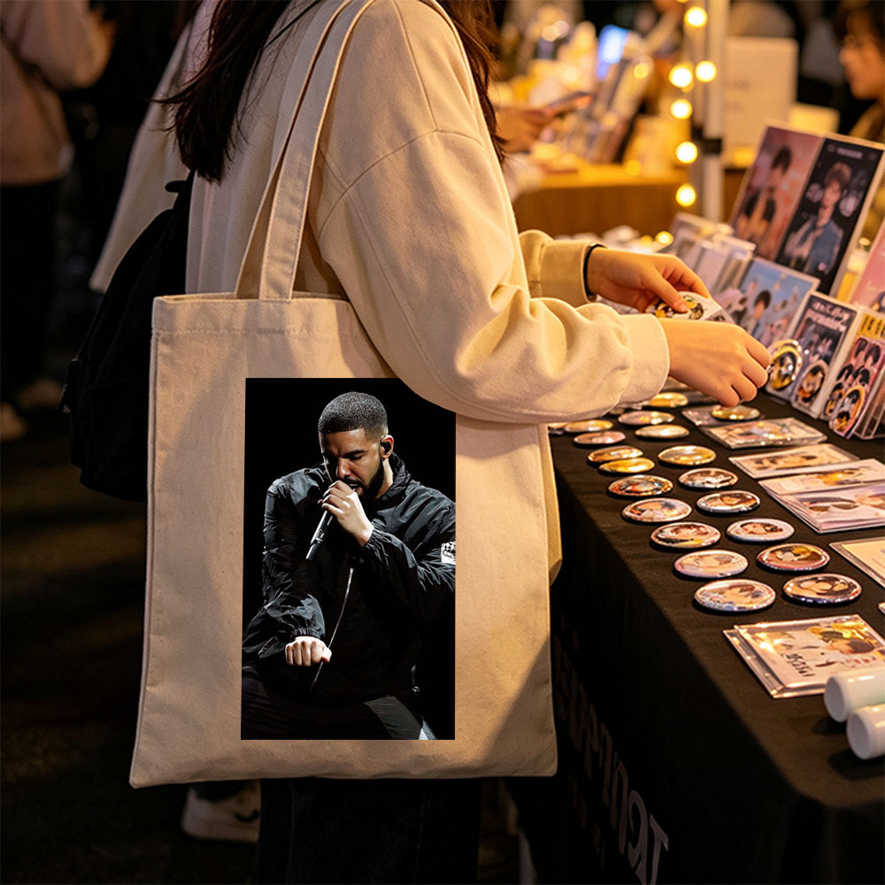 Drake Performing on Stage Holding Microphone in Black Jacket - Canvas tote bags