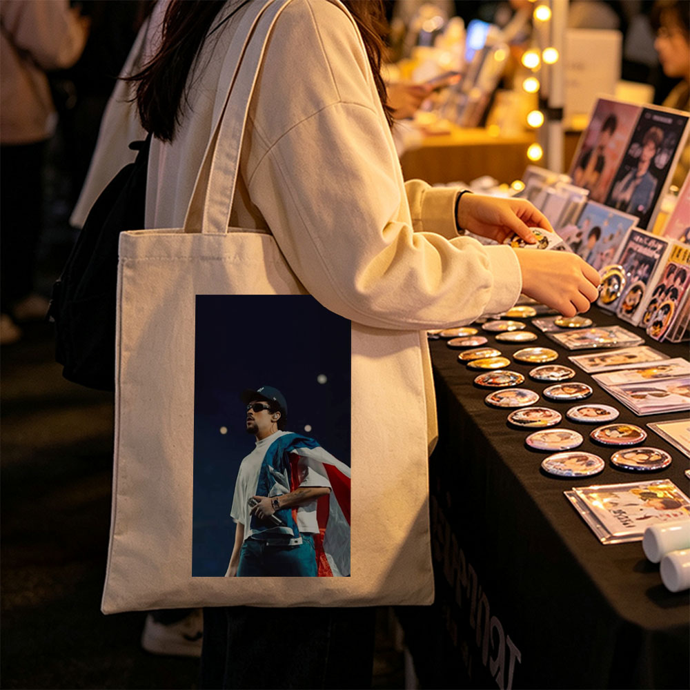 Bad Bunny Performing on Stage with Puerto Rican Flag Draped Over Shoulders - Canvas tote bags