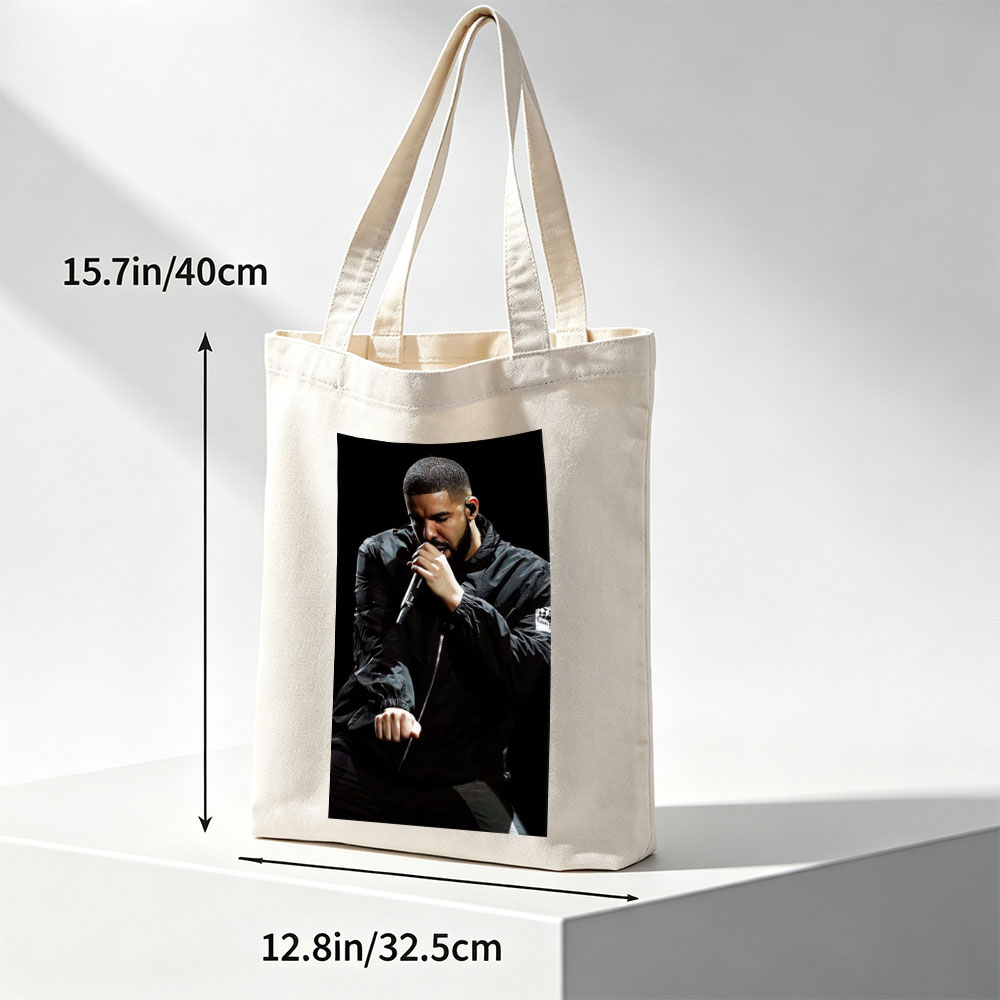 Drake Performing on Stage Holding Microphone in Black Jacket - Canvas tote bags