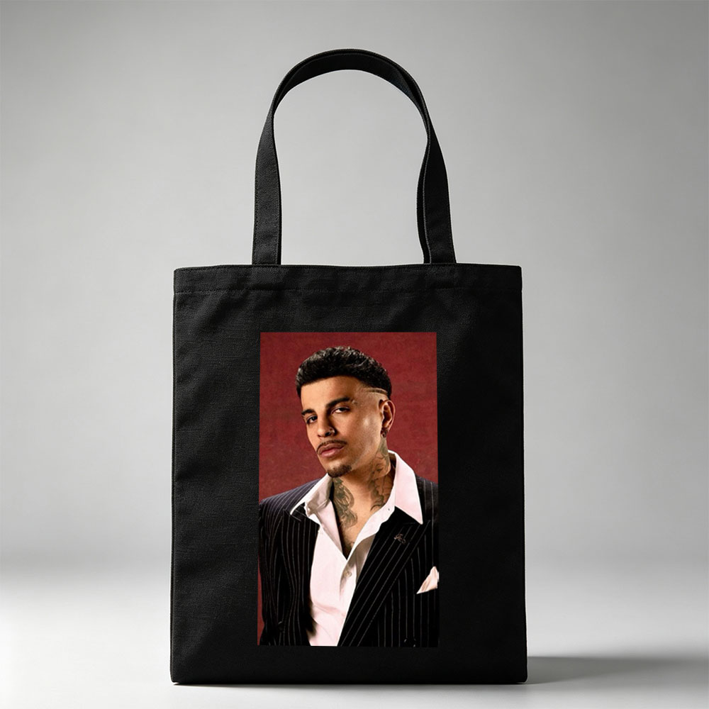 Maluma in a Pinstripe Suit with Visible Neck Tattoos Against a Red Background - Canvas tote bags