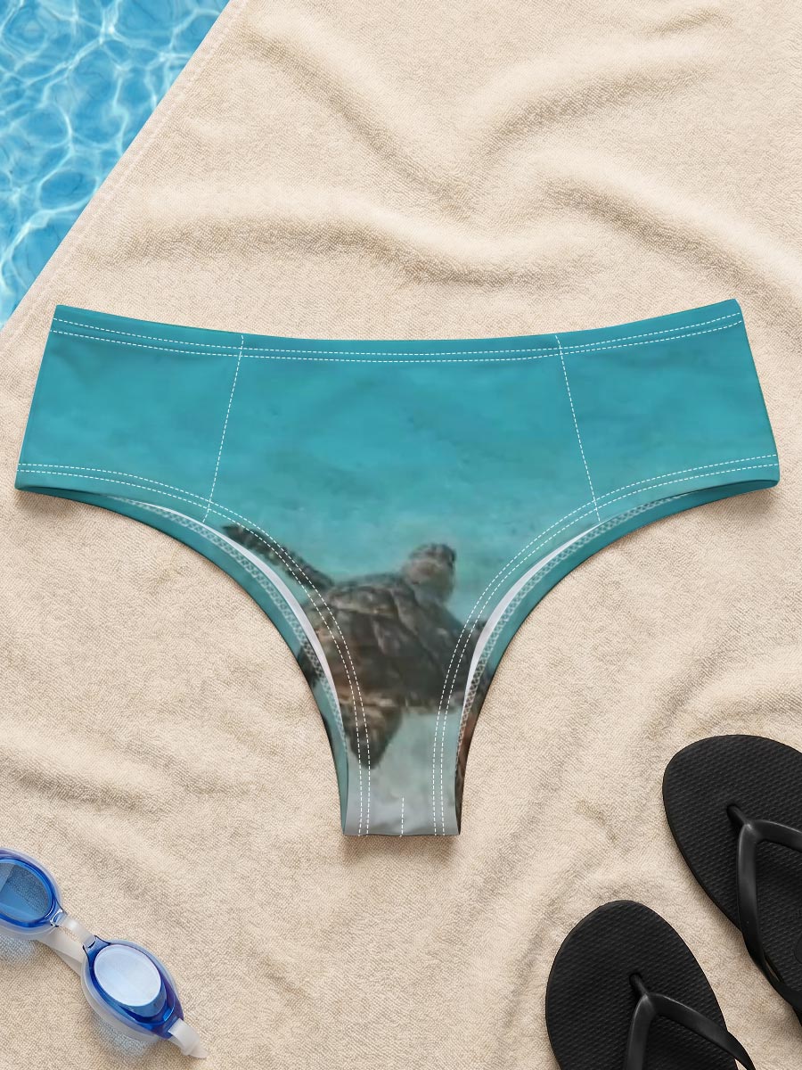 Sea turtle swimming in clear blue water over sandy ocean floor -  Men's swim trunks