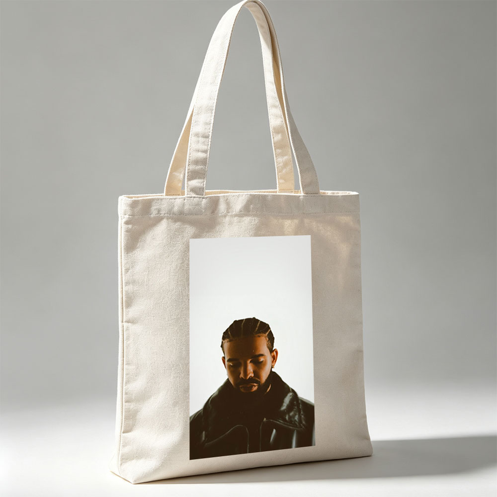 Drake in a Moody Portrait Wearing a Black Leather Jacket with Braided Hair and a Contemplative Expression - Canvas tote bags