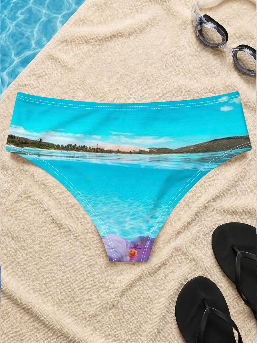 Hand holding a pink hibiscus flower over crystal-clear turquoise water under a bright blue sky. -  Men's swim trunks