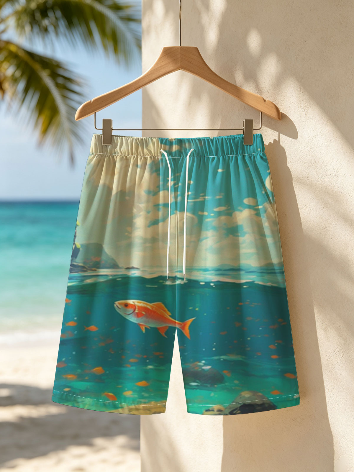 A vibrant orange fish swims gracefully in clear blue waters beneath a sunny sky. -  Beach shorts