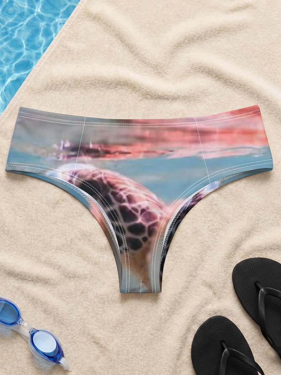 Sea turtle swimming at surface, half above water, clear blue ocean backdrop. -  Men's swim trunks