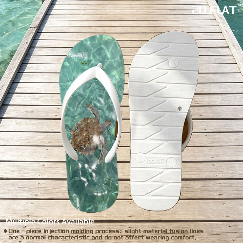 Sea turtle swims gracefully in clear turquoise waters at Playa Grandi. -  flip-flops